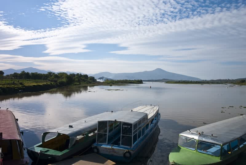 Lake Pátzcuaro at dawn, with Janitzio Island visible in the distance — home to Pátzcuaro's famous Día de Muertos and Semana Santa ceremonies
