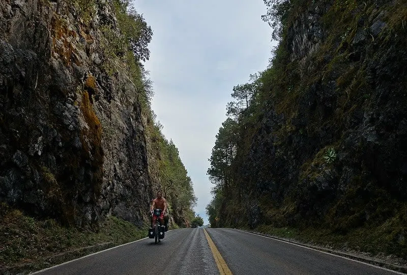 Sierra Gorda mountain route near Jalpan de Serra in September with green hills, local Independence Day travel, and rainy-season road planning