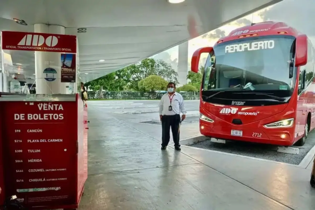 ADO bus at Cancun Airport Terminal 3 — direct service to Playa del Carmen departs frequently