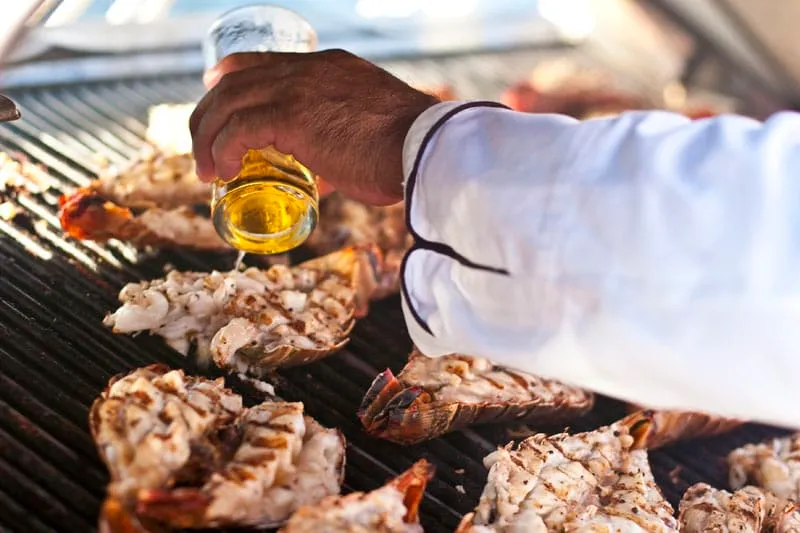 Grilled Caribbean lobster served with rice and vegetables