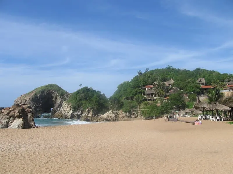 Wide Zipolite beach with Pacific surf and open sand near Puerto Escondido