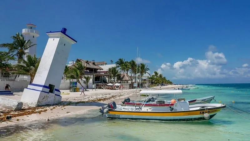 Puerto Morelos reef boats on calm Caribbean water near the town pier