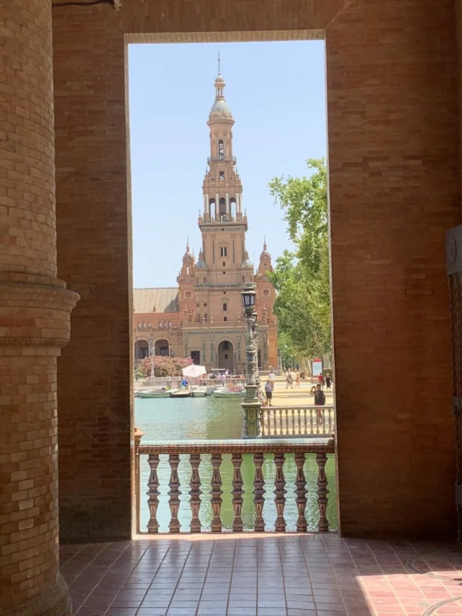 Puerto Vallarta Malecón boardwalk sculpture gallery at sunset with Templo de Guadalupe church and Sierra Madre mountains