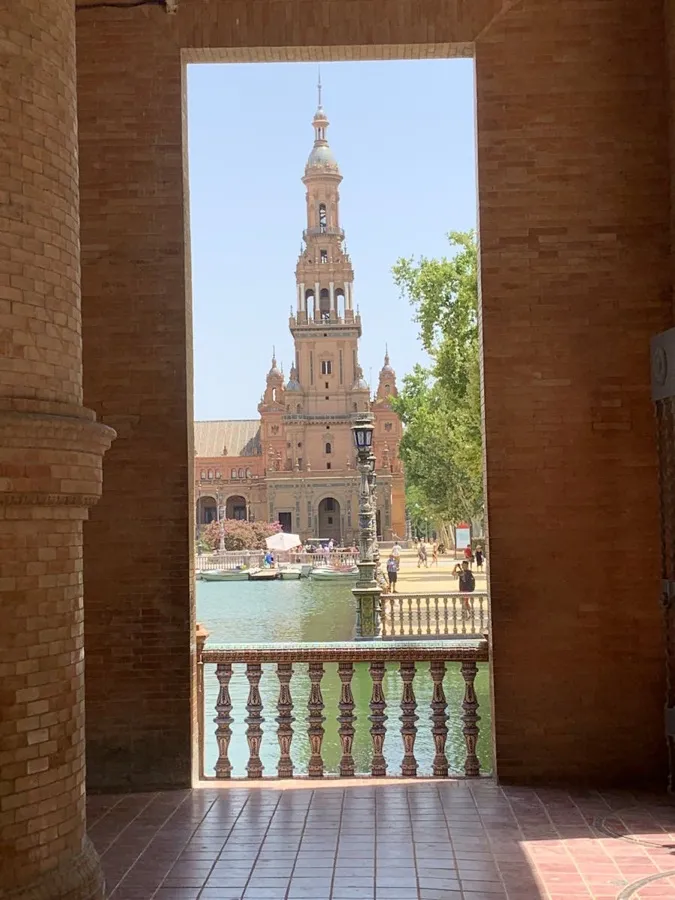 Puerto Vallarta Malecón boardwalk at night with sculptures and illuminated bars in the background