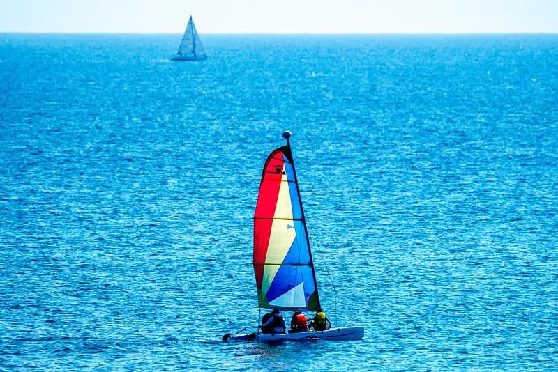 Paddleboards and beach gear set out on the sand near Punta Mita