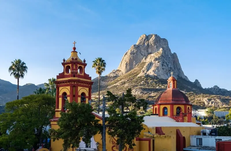 Aerial view of Querétaro's colonial roofscape with church domes and terracotta tiles