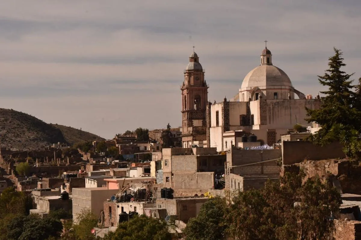 Dry high-desert light on stone buildings in Real de Catorce