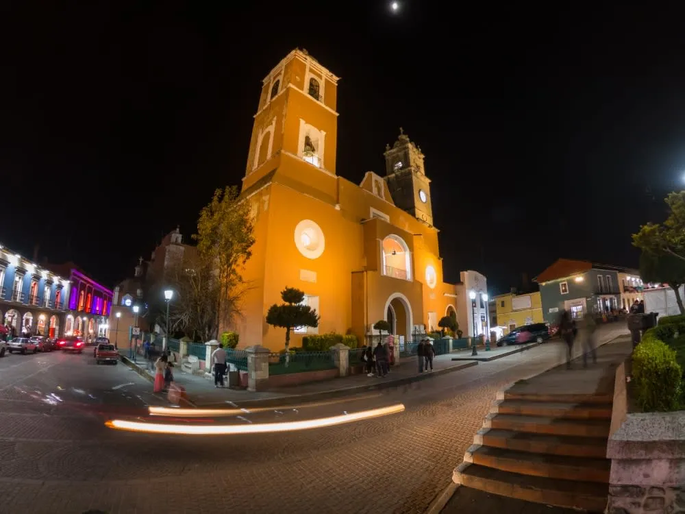 Baroque parish facade with mismatched towers in the town center