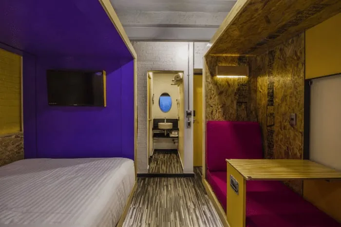 Hotel MX Roma lobby with minimalist seating and modern lighting