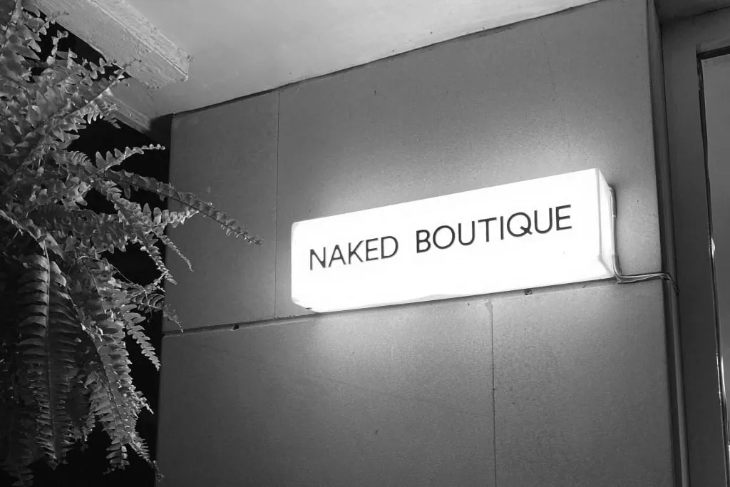 Naked Boutique storefront with contemporary clothing displays