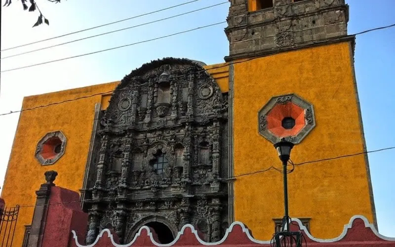 April light on a church facade in Salamanca, Guanajuato during a warm dry-season Bajio route