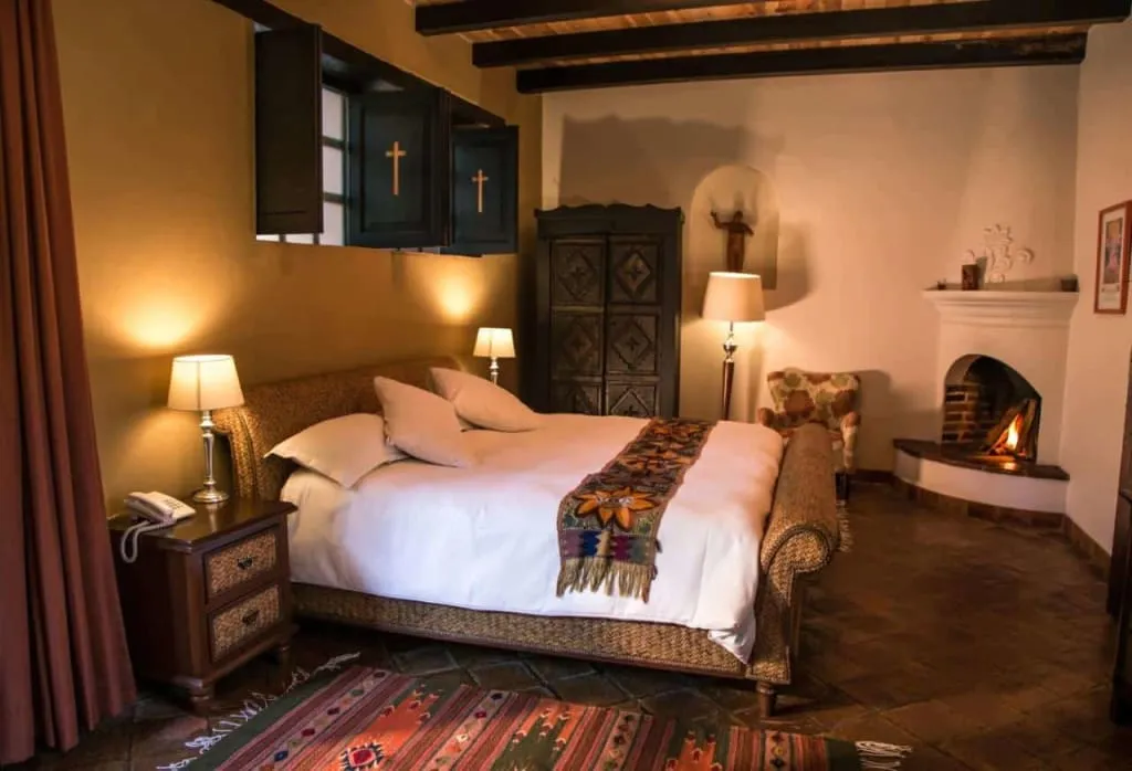 Boutique hotel courtyard with tiled roof and garden seating