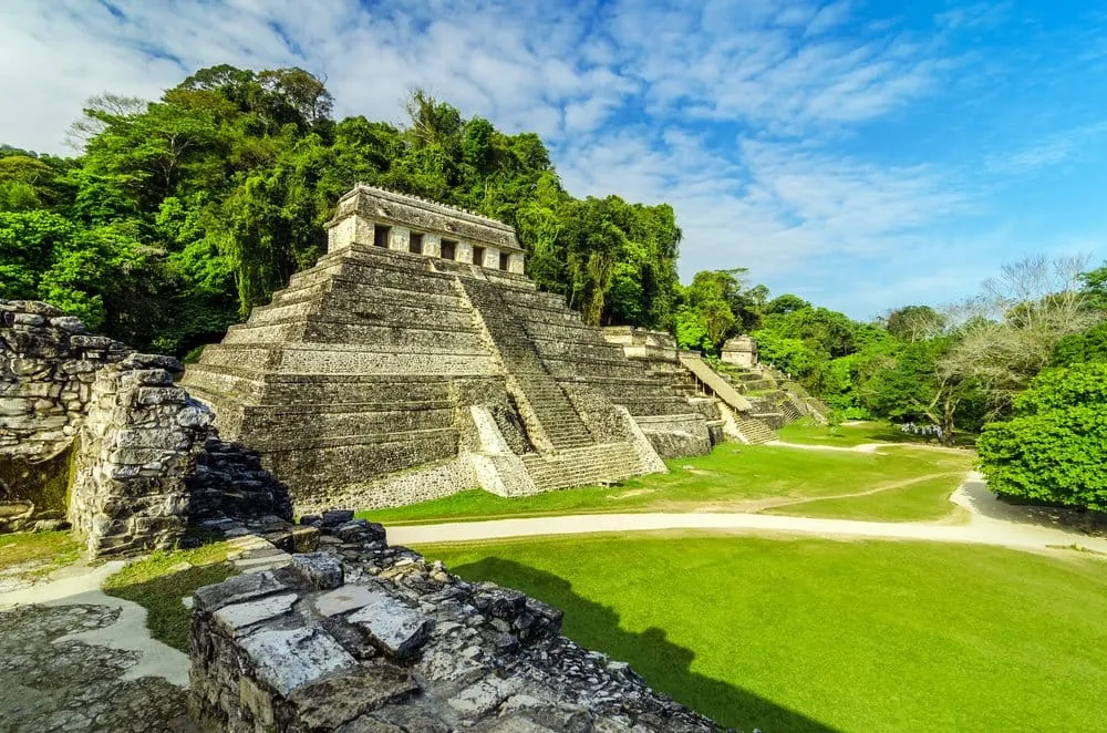 Maya ruins surrounded by jungle at Palenque Chiapas