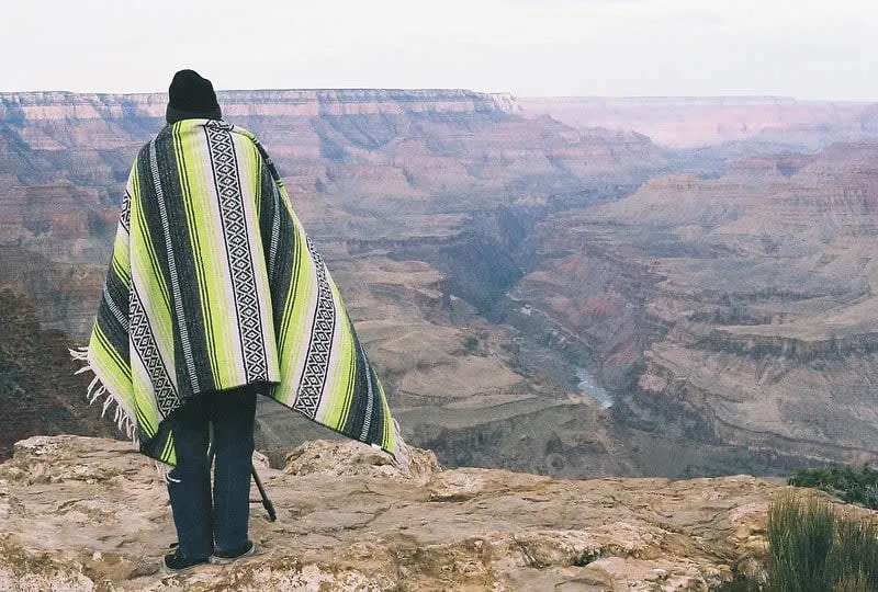 Mexican serape draped to show its bright bands and central diamond pattern
