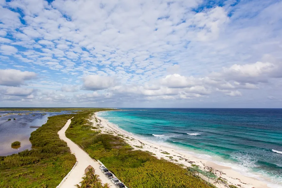 Aerial view of Sian Ka'an UNESCO biosphere reserve near Tulum — mangroves, lagoons and coral reefs accessible by organized tour during Semana Santa