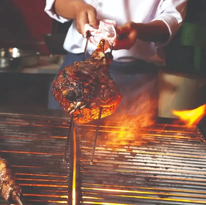 Borrego al pastor — Tapalpa's famous lamb cooked on a spit with orange marinade and oak wood, served with fresh tortillas