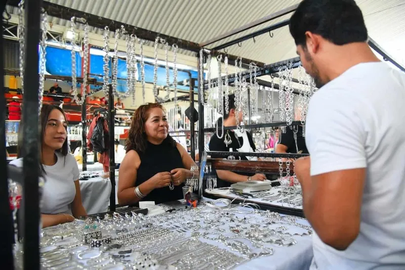 Silver necklaces and bracelets displayed inside a Taxco jewelry shop