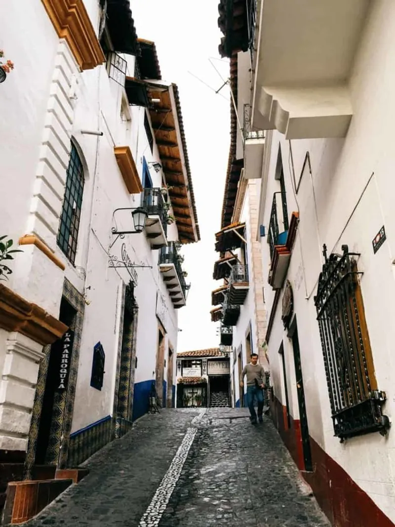 Taxco in March with white hillside houses and steep colonial streets in Guerrero