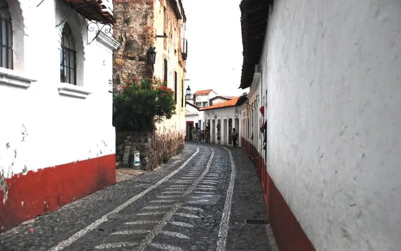Steep Taxco streets for December Christmas walks, silver shopping, and evening lights