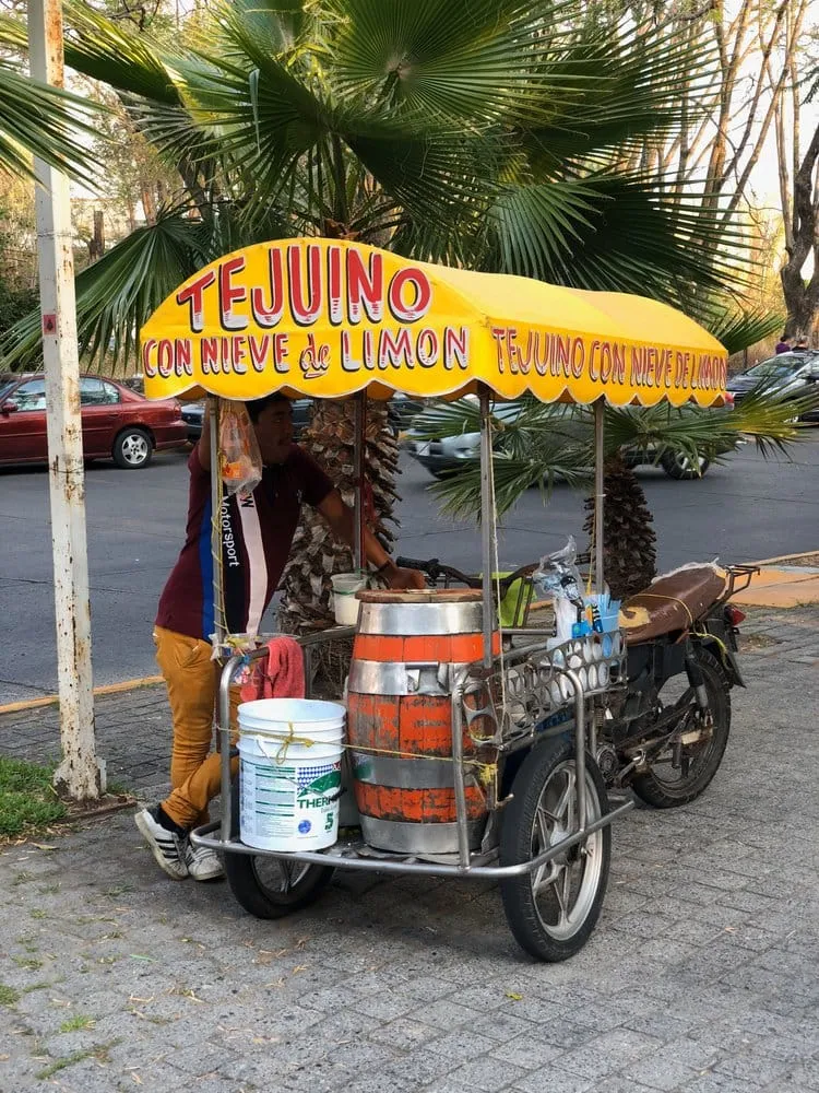 Street cup of tejuino topped with lime and salt