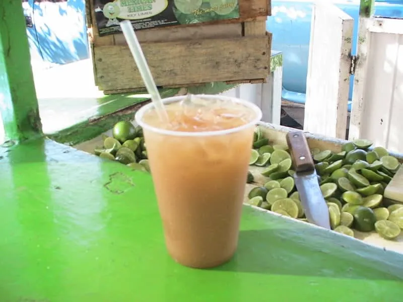 Cold tejuino served with lime in a clear glass
