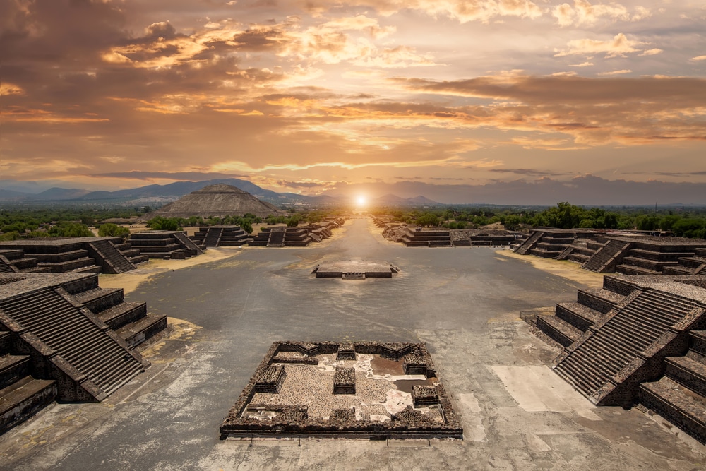Teotihuacan archaeological site aerial view showing the Pyramid of the Sun and Avenue of the Dead stretching north toward the smaller Pyramid of the Moon