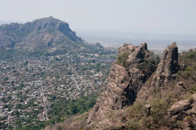El Tepozteco hike in June with steep stone trail, green mountains, humid weather, and storm-aware planning