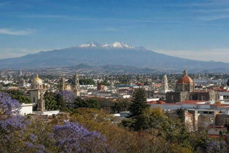 Spring view over Toluca in April with Nevado de Toluca beyond the highland city