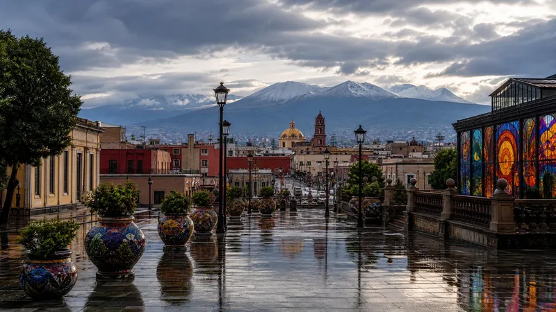 Rain-wet Toluca plaza with volcanic highlands under cloudy late-summer skies