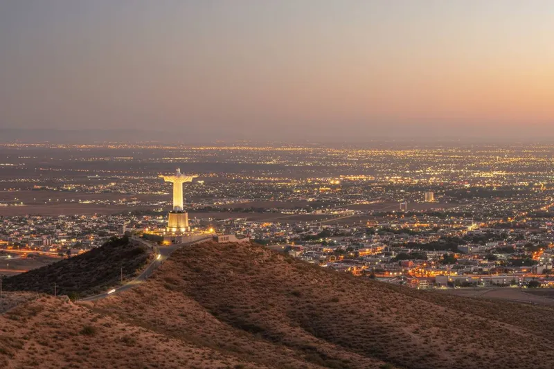 Dry desert view over Torreon with Cristo de las Noas and northern Mexico roads nearby