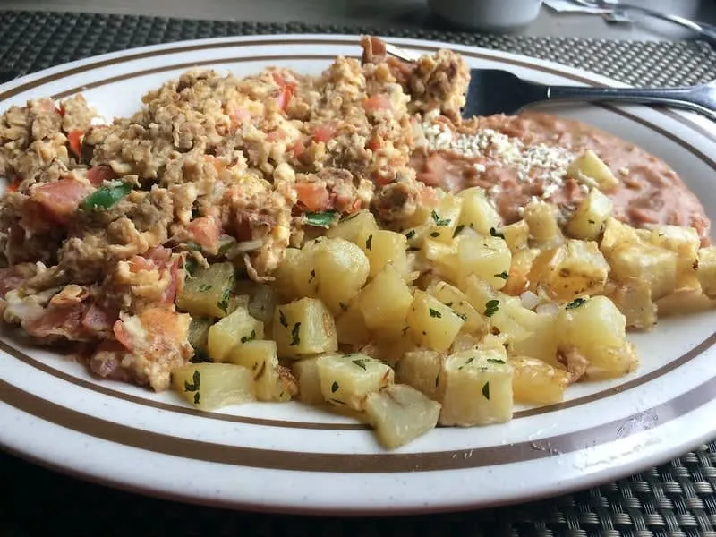 Machaca con huevos with shredded dried beef, scrambled eggs, and tortillas