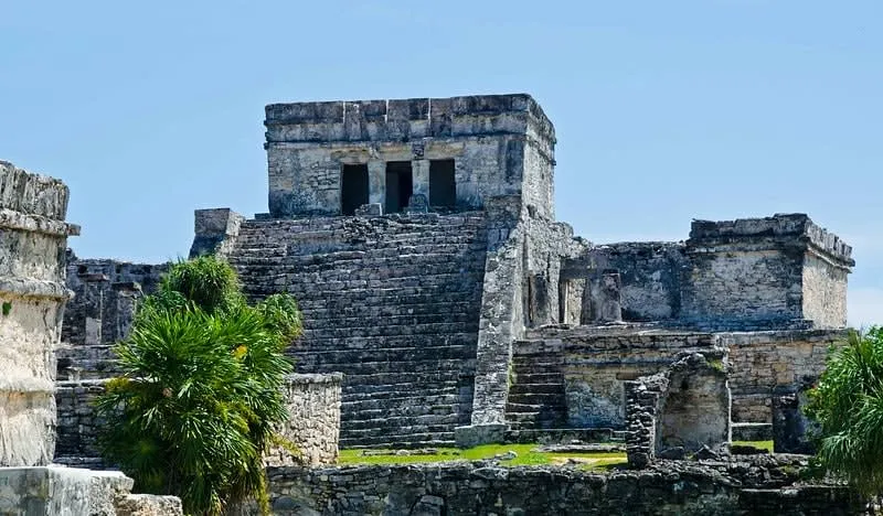 Tulum archaeological ruins overlooking the Caribbean Sea in December — peak season delivers perfect weather and the best beach conditions of the year