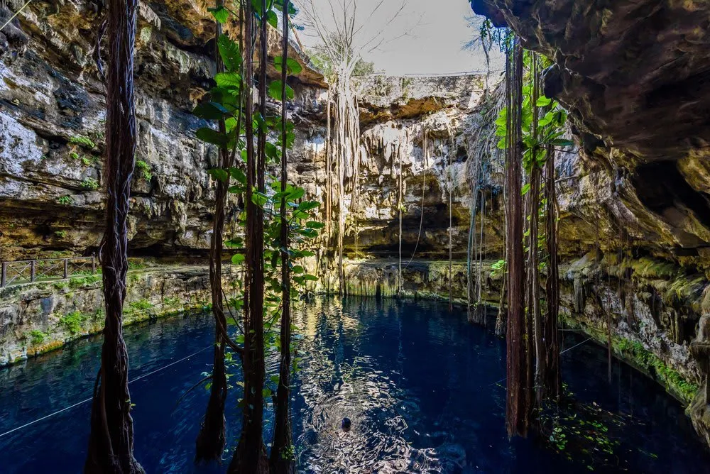 Cenote San Lorenzo Oxman open-air cenote with hacienda walls and rope swing, near Valladolid