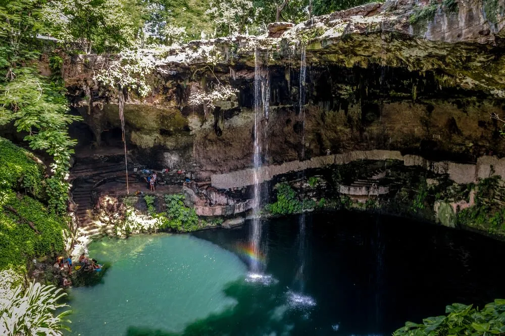 Limestone cenote pool near Valladolid with clear blue water