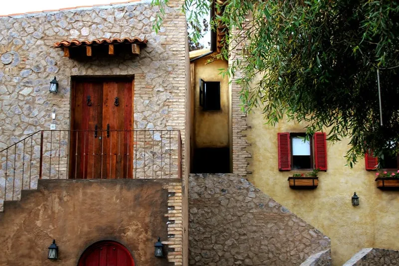 Val'Quirico stone buildings and open plaza during clear December highland weather