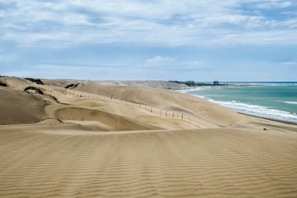 Golden Sabanal dunes rising beside Chachalacas beach