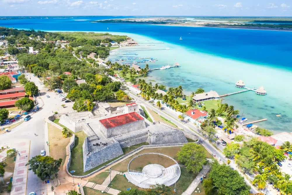 Bacalar lagoon shoreline with calm blue water