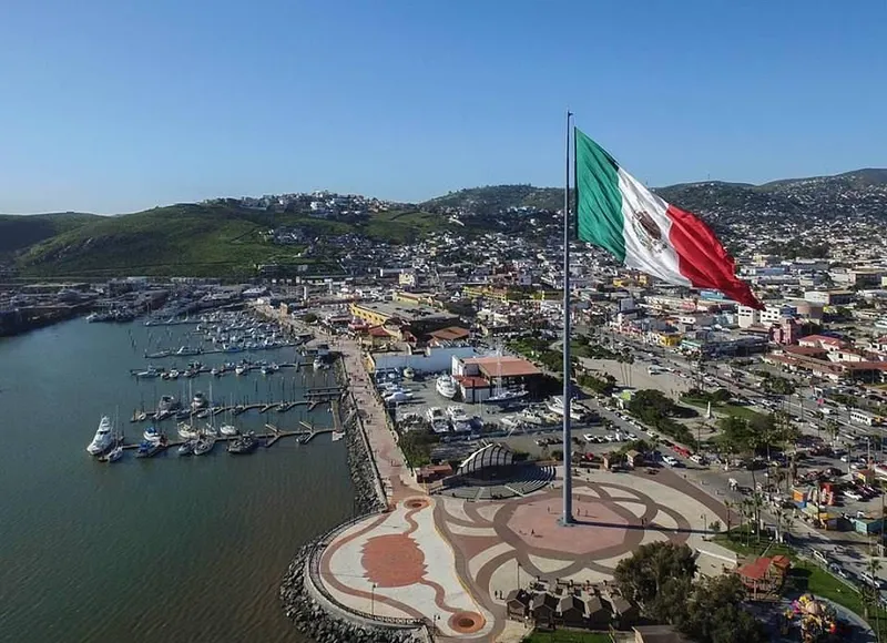 Tijuana street food spread with Caesar salad prepared tableside, Baja fish tacos, and carne asada on Avenida Revolución in Baja California