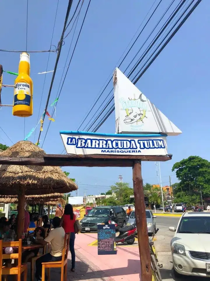 Casual Tulum restaurant table with tacos and cold drinks after a lagoon swim
