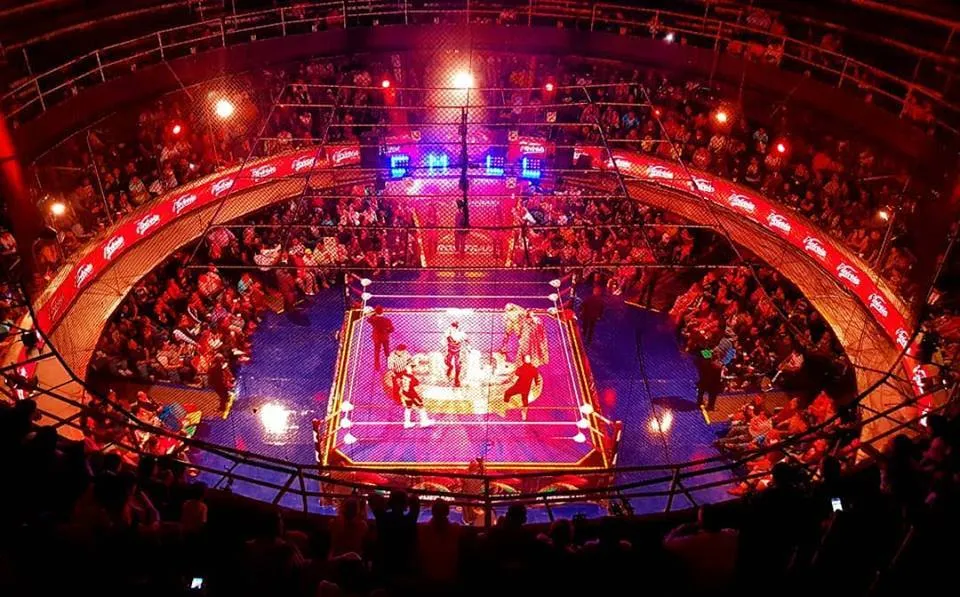 Arena Coliseo seating wraps closely around a Mexico City wrestling ring