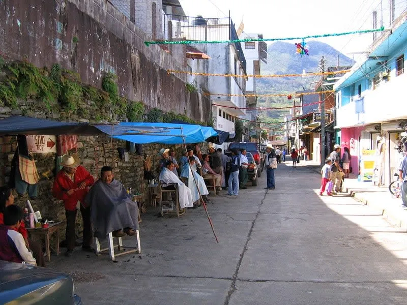 Xilitla town view with hillside roofs and forested Huasteca ridges