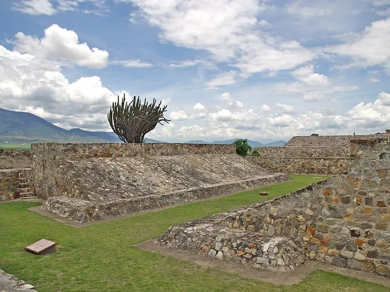 Yagul archaeological zone on a hilltop in the Valley of Oaxaca, with the ancient ball court, residential courts, and panoramic views of the valley and surrounding mountains