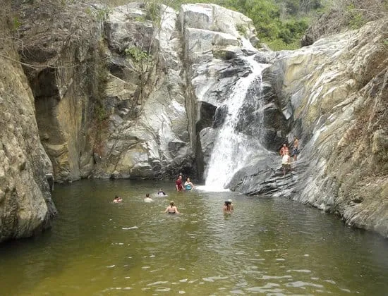 Rocky trail and waterfall pool inland from Quimixto beach