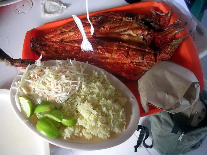 Tikin-xic — whole grilled fish marinated in achiote and sour orange, wrapped in banana leaves from Yucatan coast