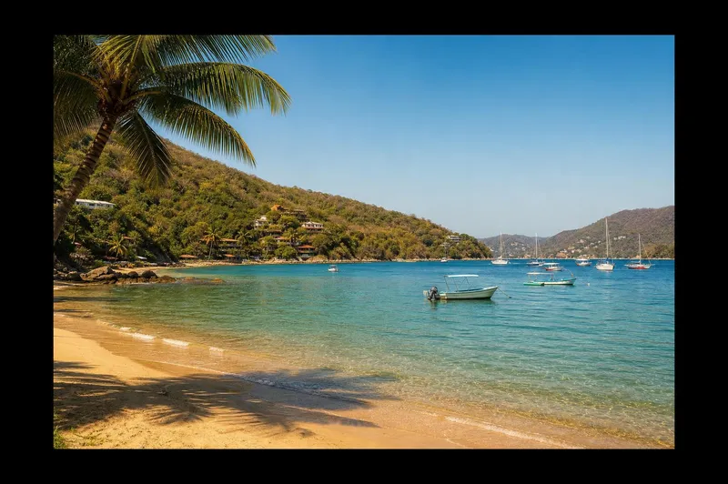 Boats floating on Zihuatanejo Bay with La Ropa Beach curving behind them