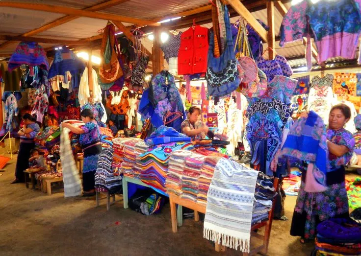 Morning market stalls selling local textiles in Zinacantán
