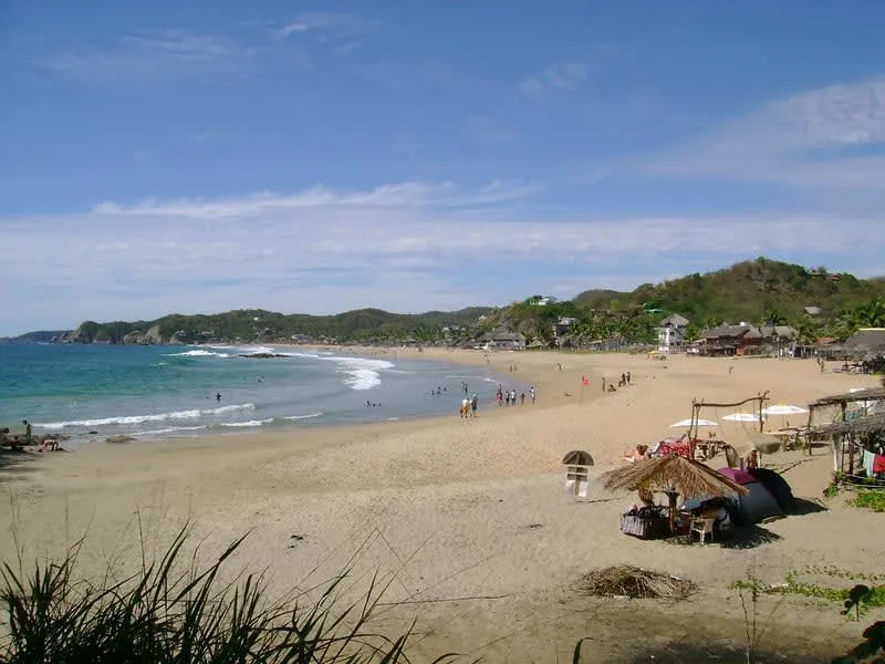 Rocky entrance to Playa Amor on the edge of Zipolite during August travel season