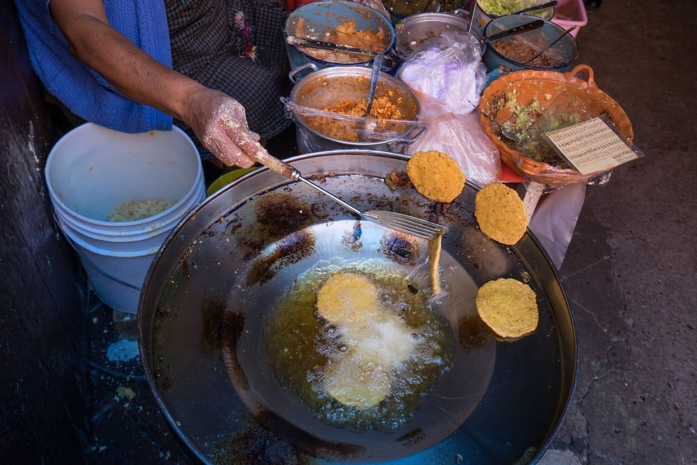 Traditional bocoles being prepared at a family lonchería in the Huasteca Potosina region