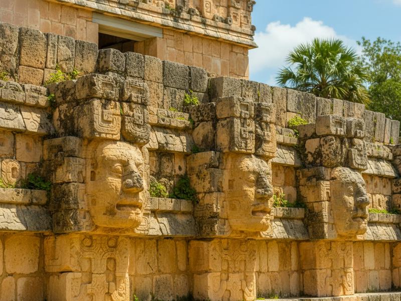 Carved stone details and architectural elements on a temple structure at Edzná ruins