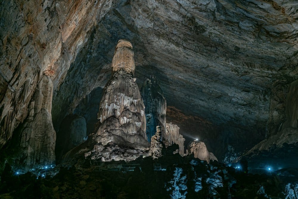 Interior of Grutas de Cacahuamilpa showing cathedral-scale cave chamber with stalactites hanging from vaulted ceiling